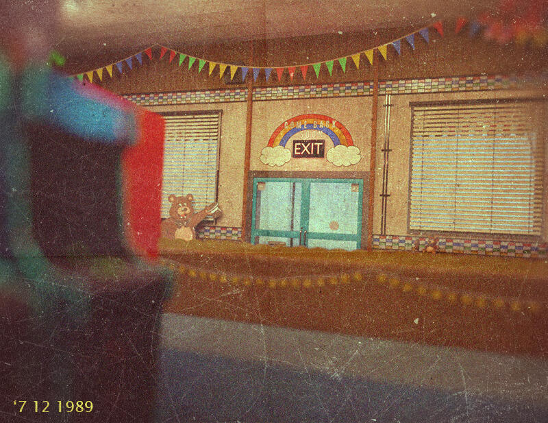 Photograph of the entrance to the building, taken from the arcade.